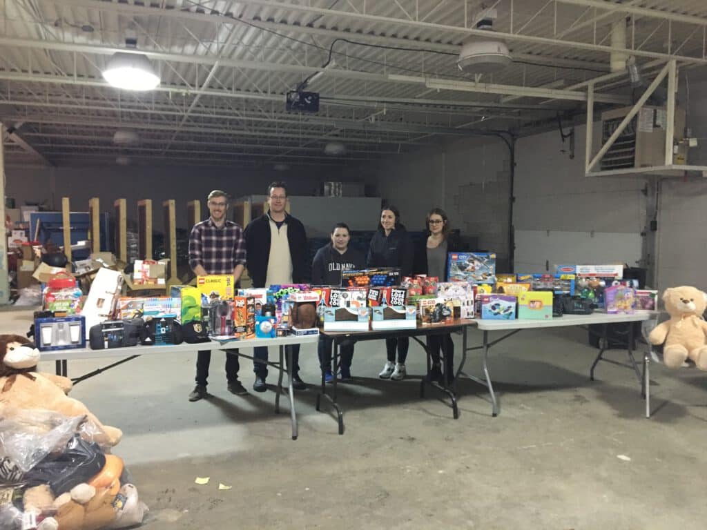 An image of five Ford Keast LLP team member with the toys gathered for the Glen Cairn toy drive.