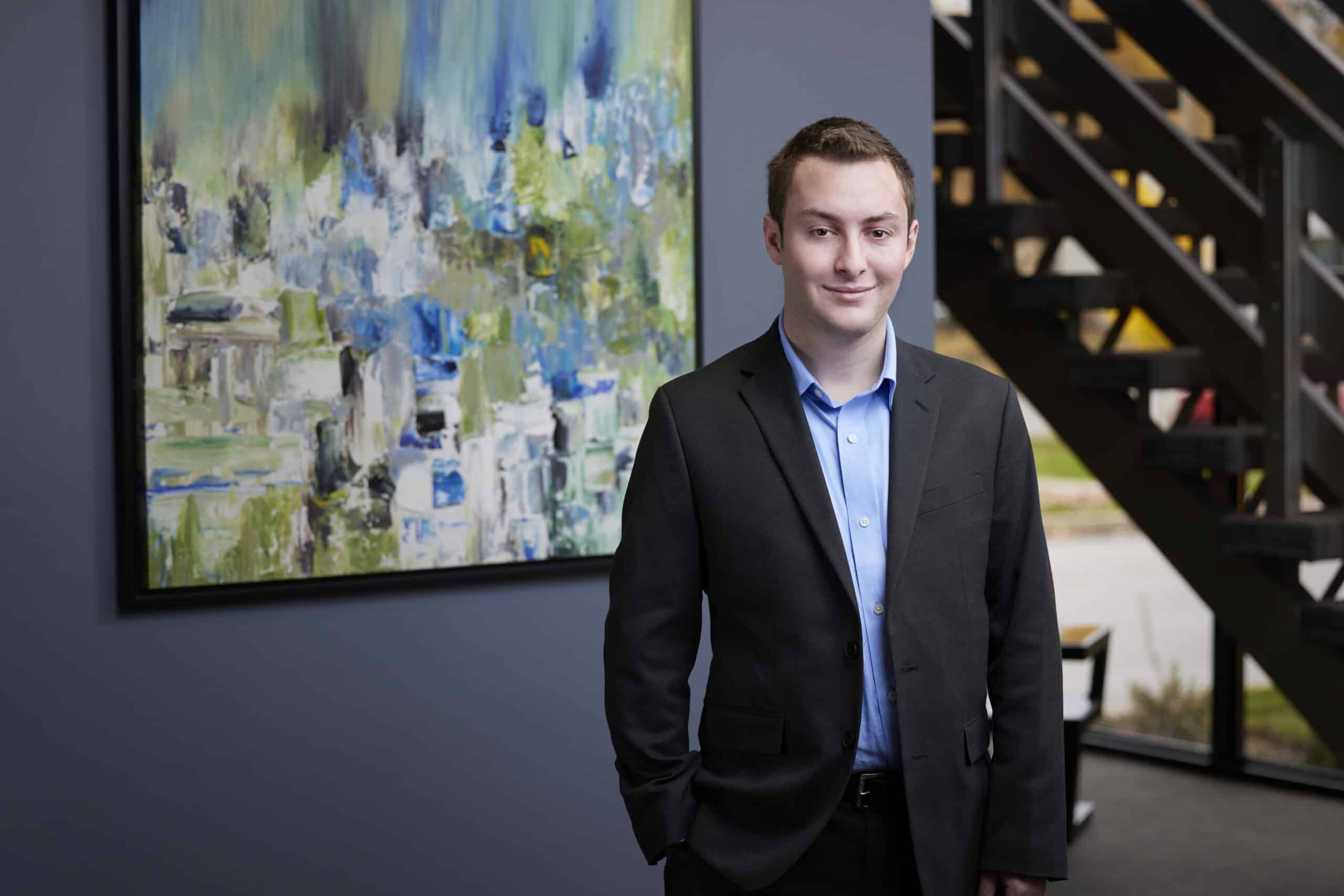 An image of Russell Kaufman, a professional staff intern, standing in the Ford Keast LLP reception area in London.