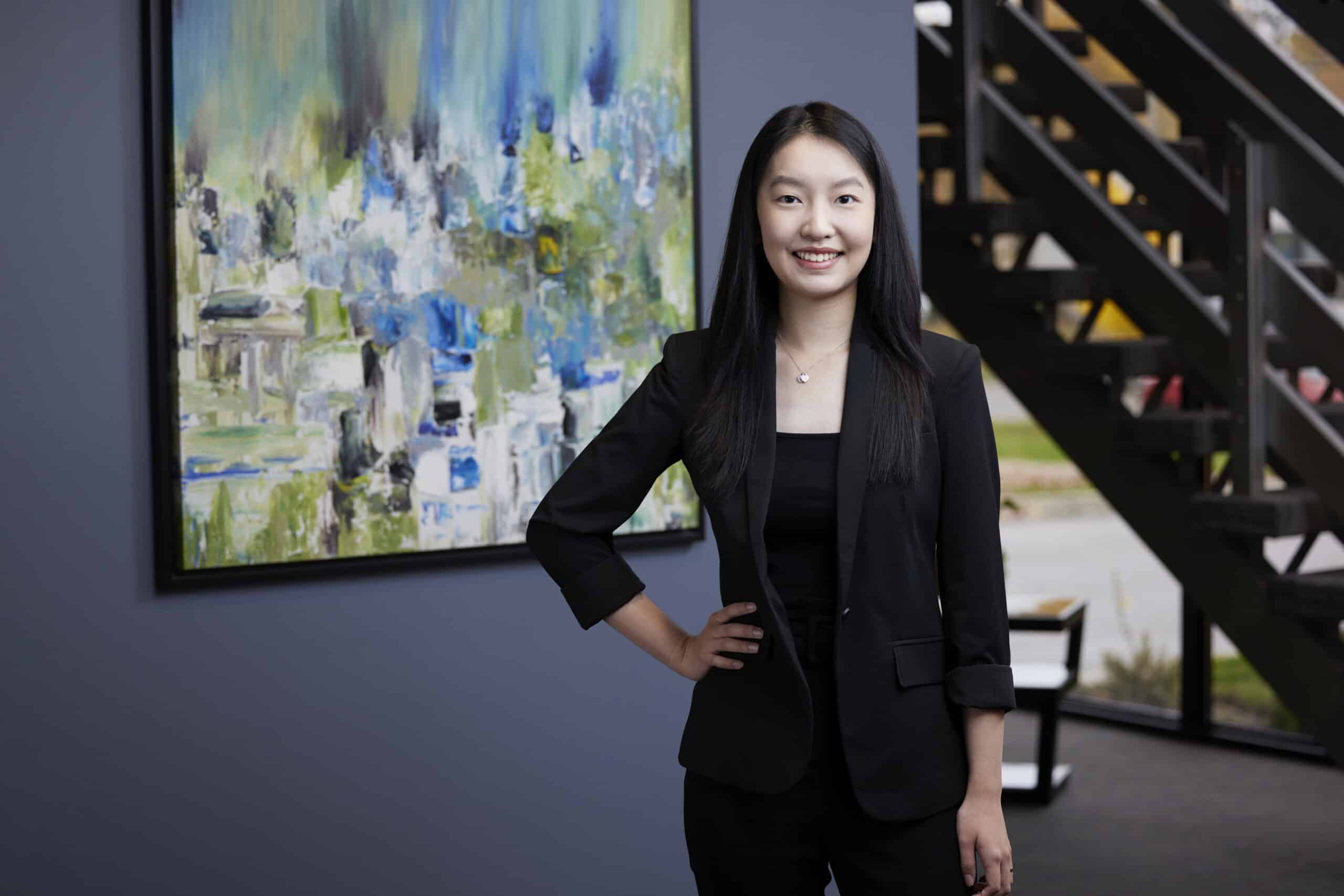 An image of Tina Liu, at Ford Keast LLP in the reception area of the London Office