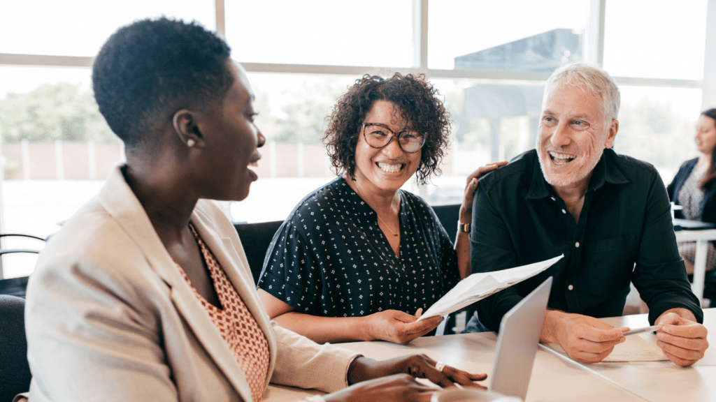 Two elderly business owners discussing how to setup Employee Stock Ownership Plans (ESOPs) for their small business in London Ontario