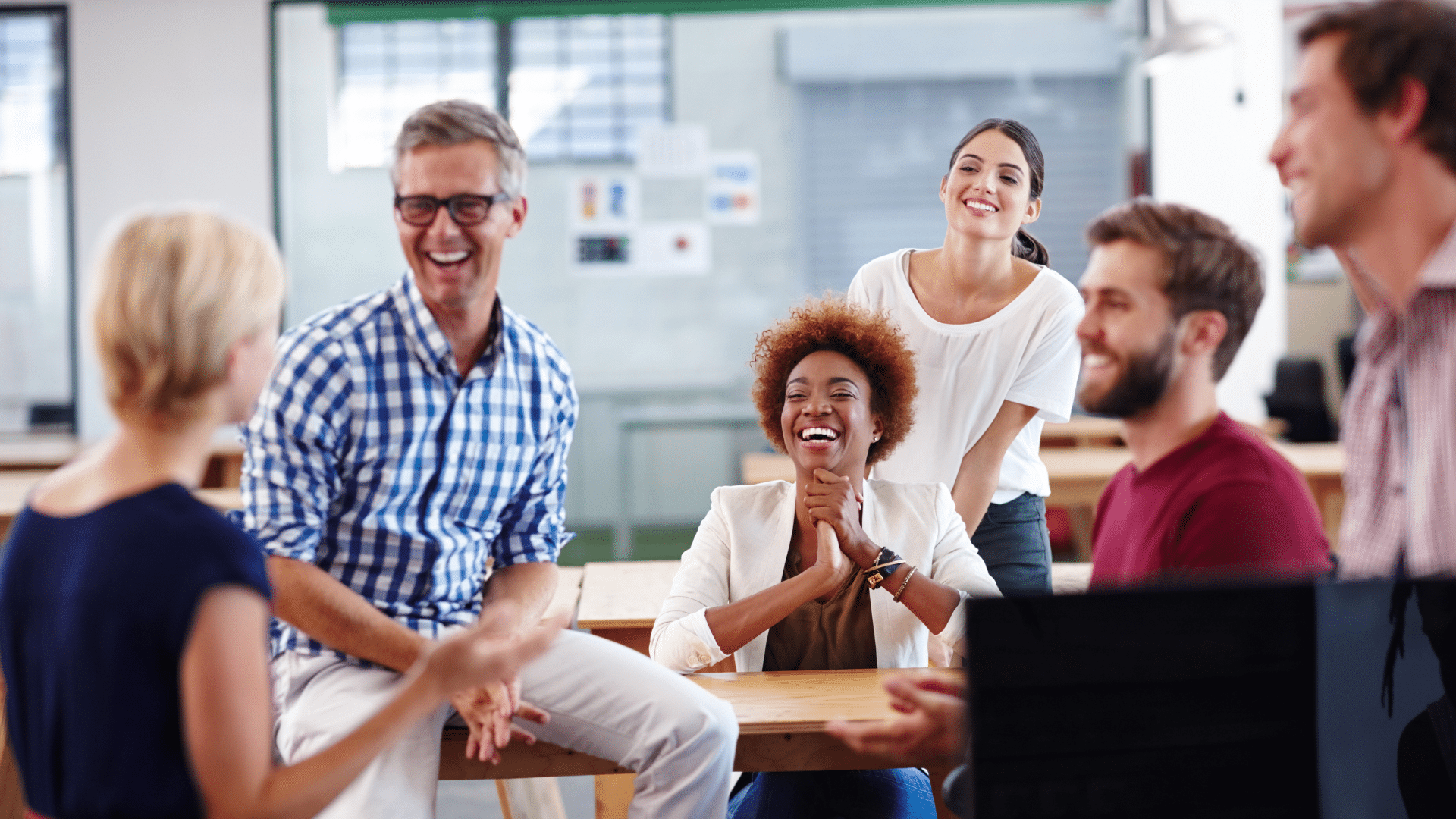 An image of a team meeting at an office in London where they are discussing workplace flexibility.