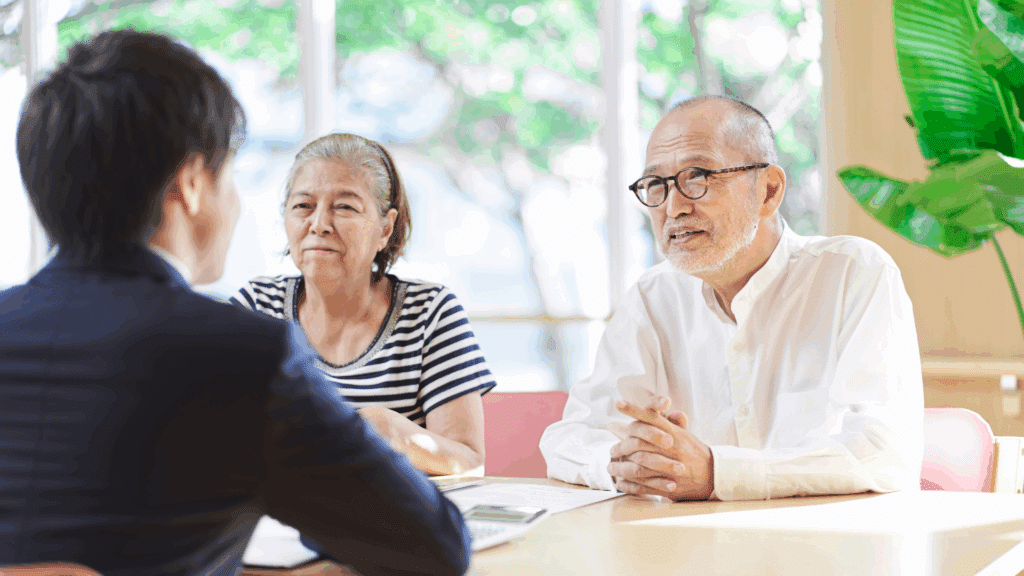 An image of a couple meeting with their tax and estate advisor at Ford Keast LLP in London, to go over their inheritance tax options
