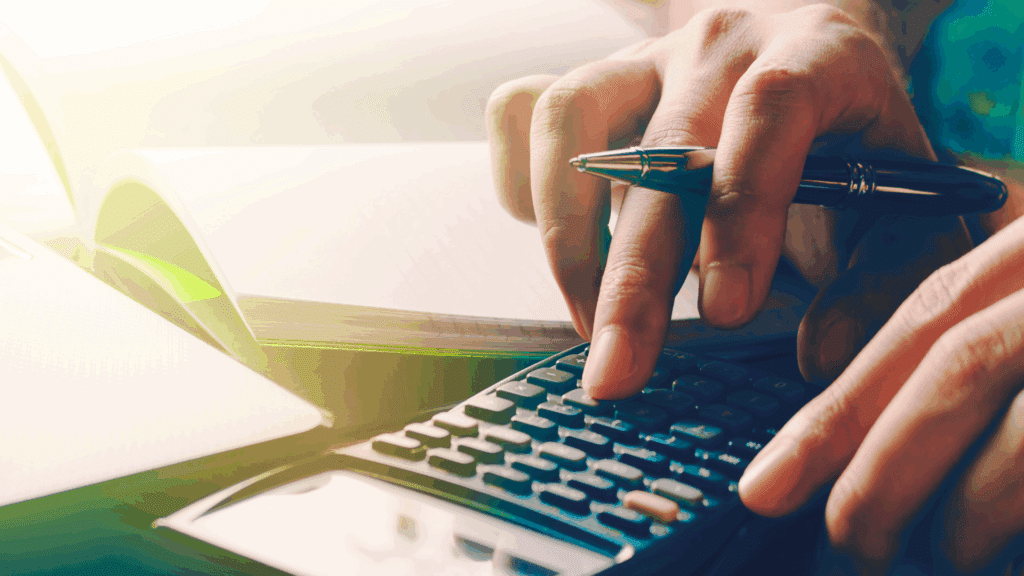 An image of a small business consultant from Ford Keast LLP in London Ontario calculating a clients profitability after their scheduled meeting
