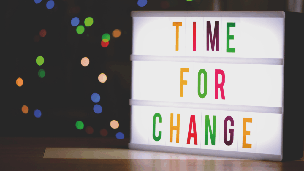 An image of a sign in a small business in London Ontario that states Time For Change
