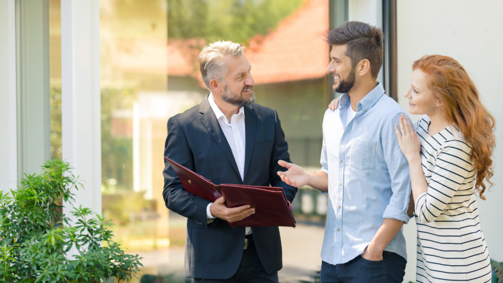 An image of a London Ontario real estate agent meeting with his clients to show them a new property