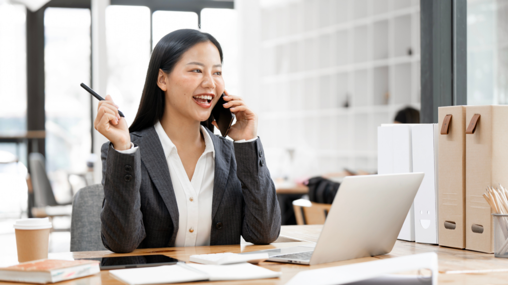 An image of a local London CPA who is chatting with a client about their long term goals.