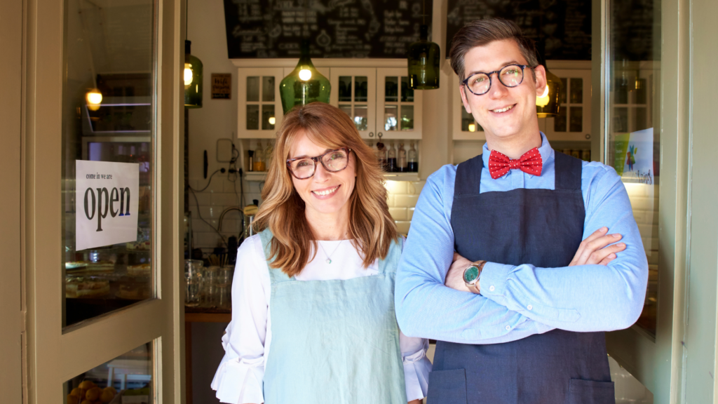 An image of a multigenerational business owner out front of their small shop in London Ontario