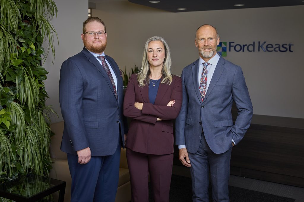An image of the Ford Keast Wealth Management team in the lobby of the Ford Keast LLP office in London Ontario.
